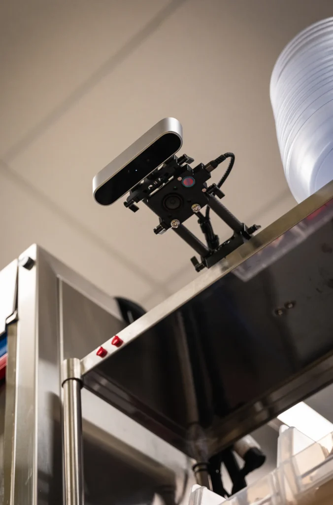 Camera above the verification station photographing each plate