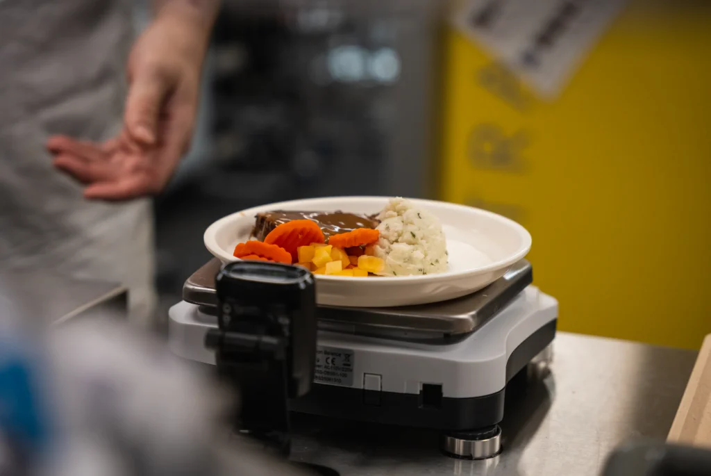 Plate weighed at the verification station before it leaves the kitchen
